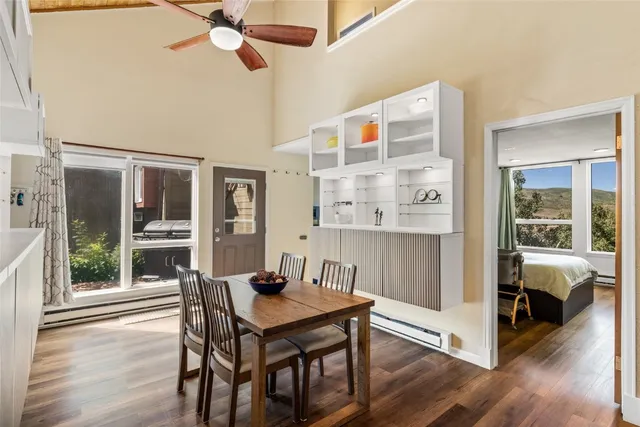 a view of a dining room with furniture and wooden floor