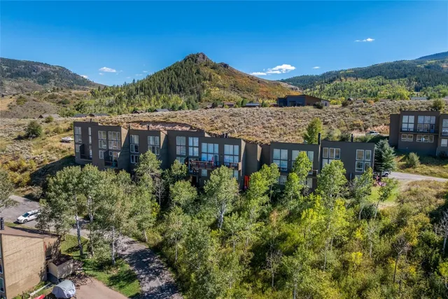a view of a house with a yard and balcony