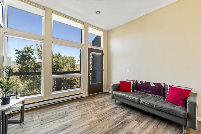 a living room with a couch and a window