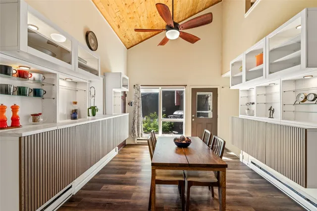 a view of a dining room with furniture window and wooden floor