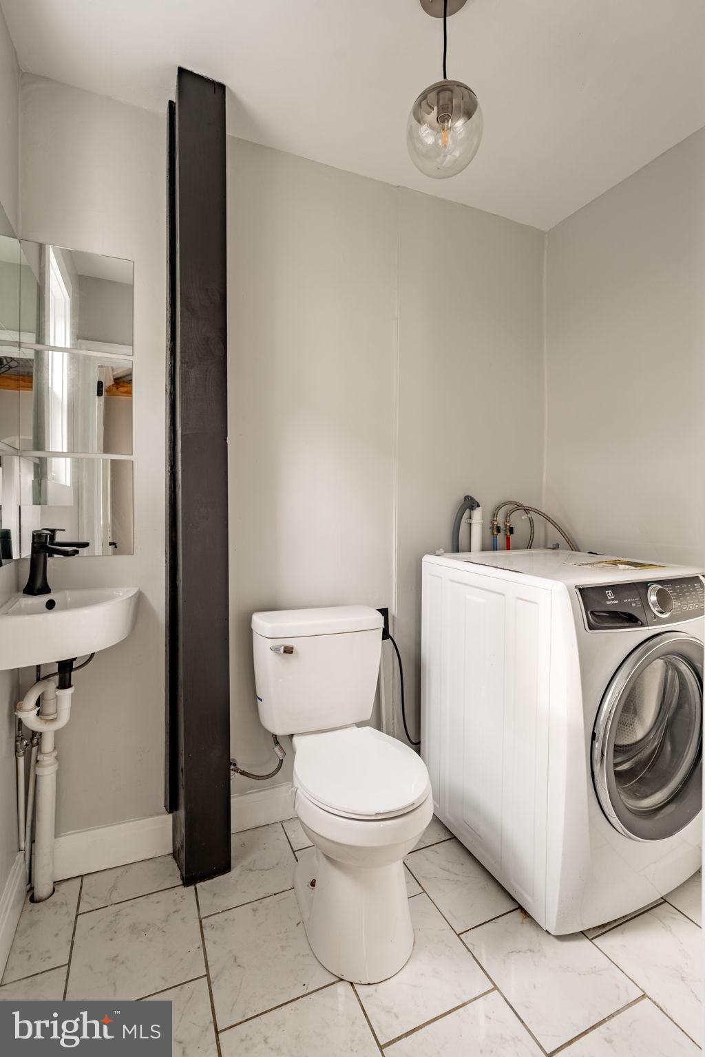 471 High Street Lancaster, PA 17603 - Photo 11 of 22 a white toilet sitting next to a bathroom sink