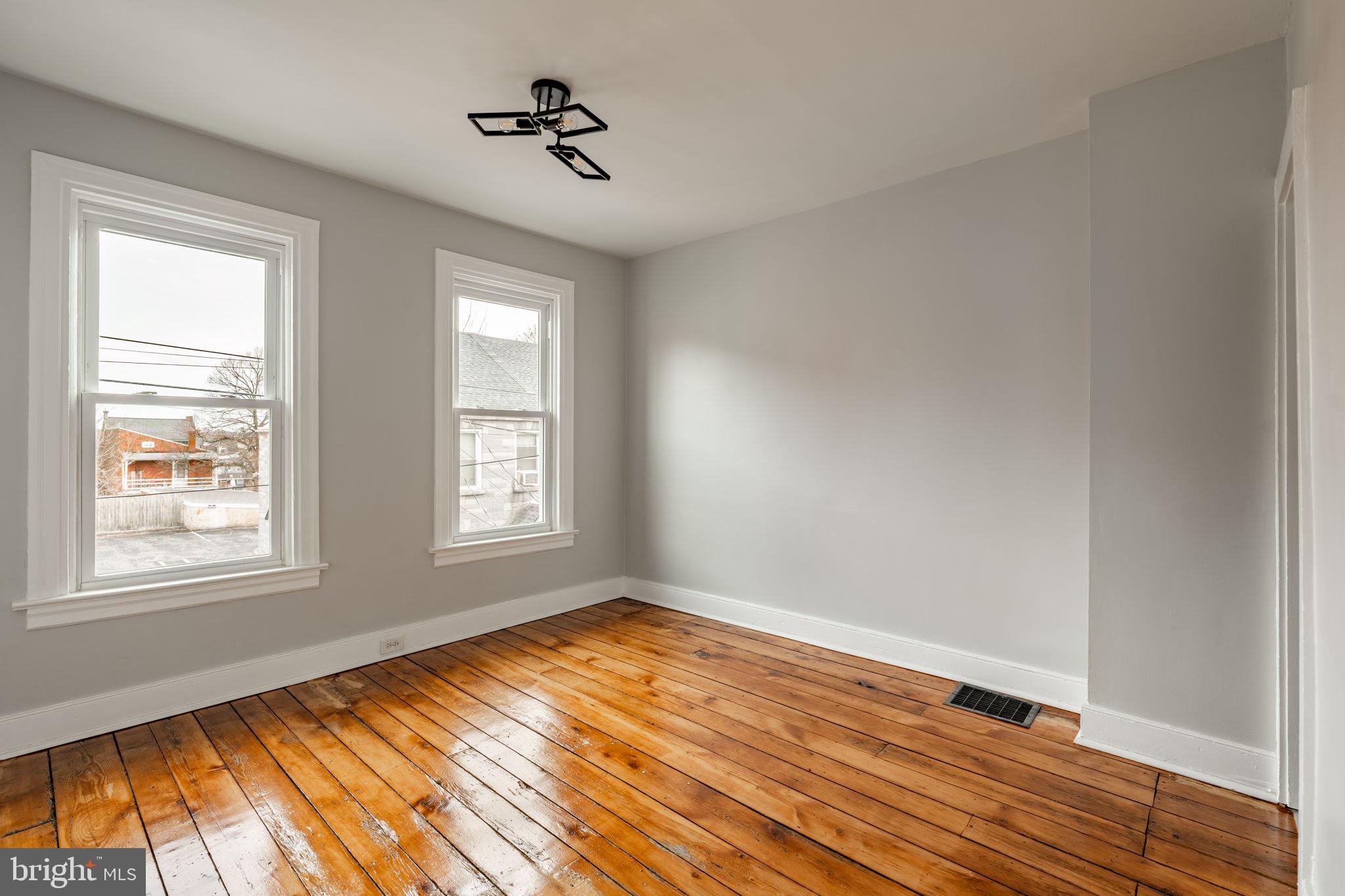 471 High Street Lancaster, PA 17603 - Photo 13 of 22 a view of empty room with wooden floor and fan