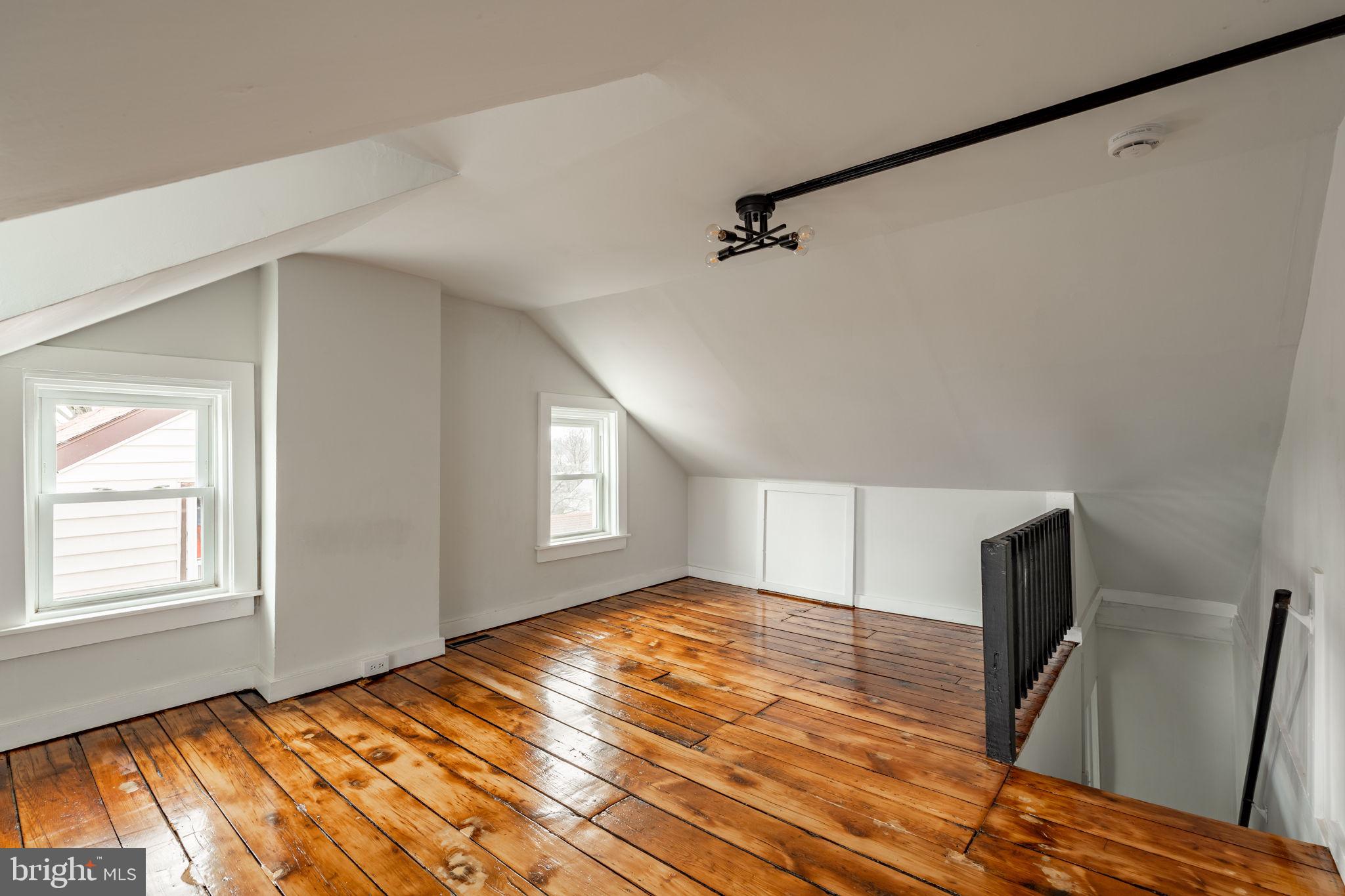 471 High Street Lancaster, PA 17603 - Photo 18 of 22 a view of an empty room with wooden floor and a window