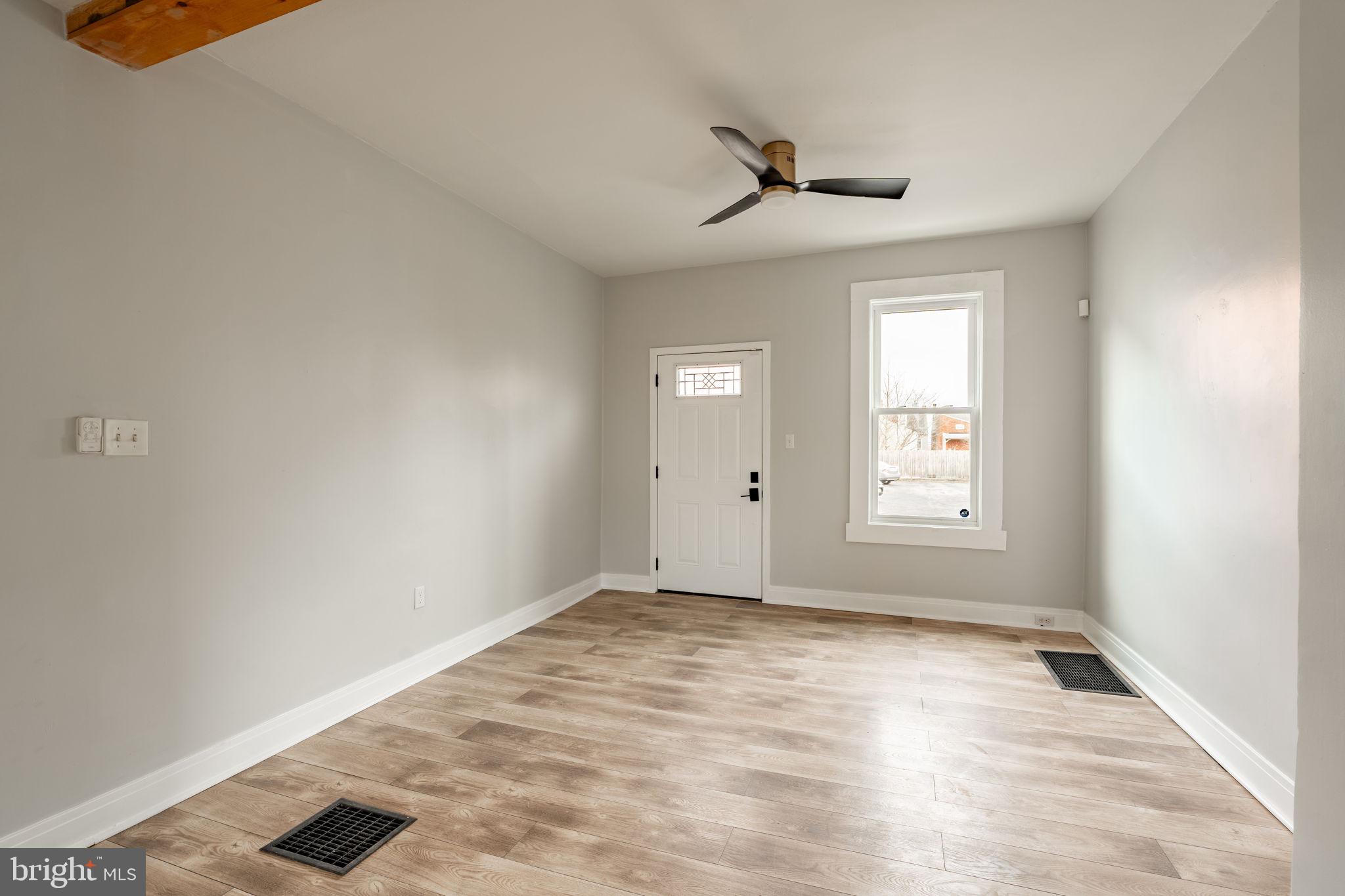471 High Street Lancaster, PA 17603 - Photo 6 of 22 wooden floor in an empty room with a window
