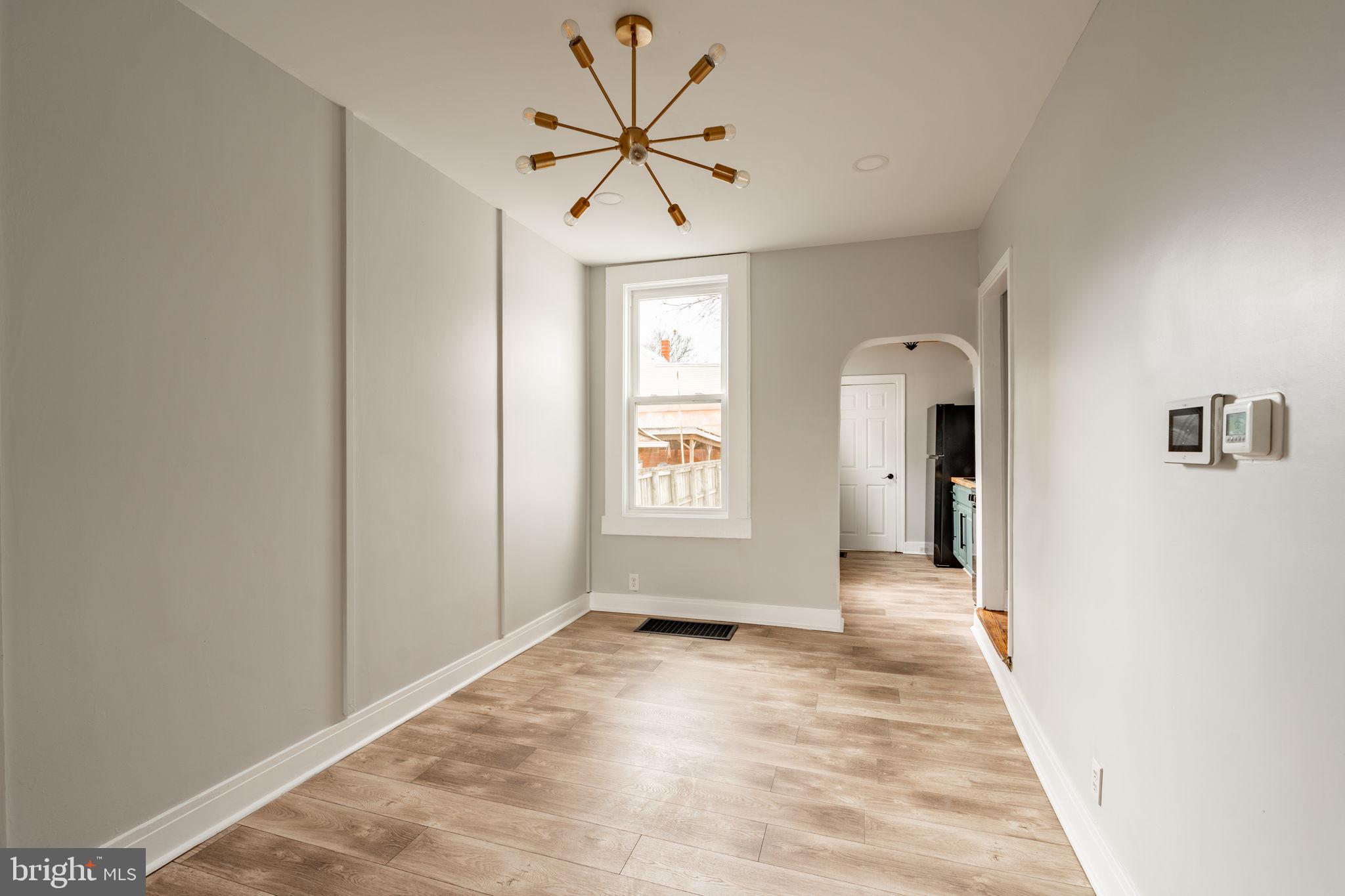 471 High Street Lancaster, PA 17603 - Photo 7 of 22 a view of a hallway with a chandelier fan and windows