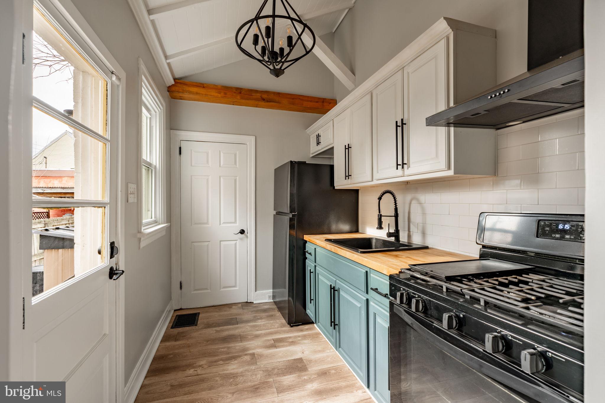 471 High Street Lancaster, PA 17603 - Photo 8 of 22 a kitchen with stainless steel appliances granite countertop a stove and a sink