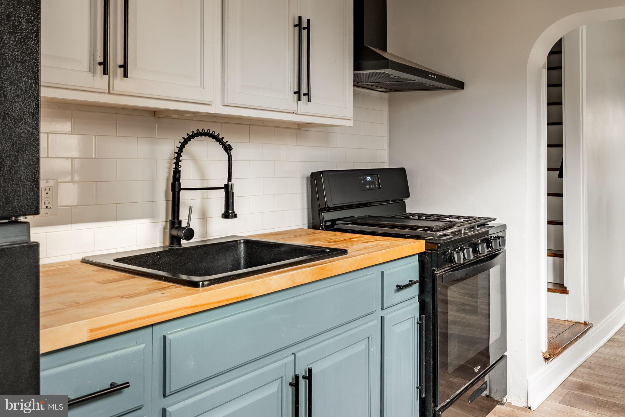 471 High Street Lancaster, PA 17603 - Photo 10 of 22 a kitchen with stainless steel appliances granite countertop a sink and a stove