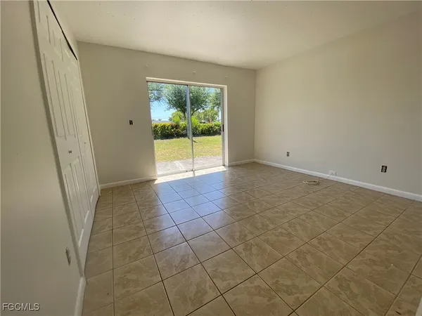 a view of an empty room and a window