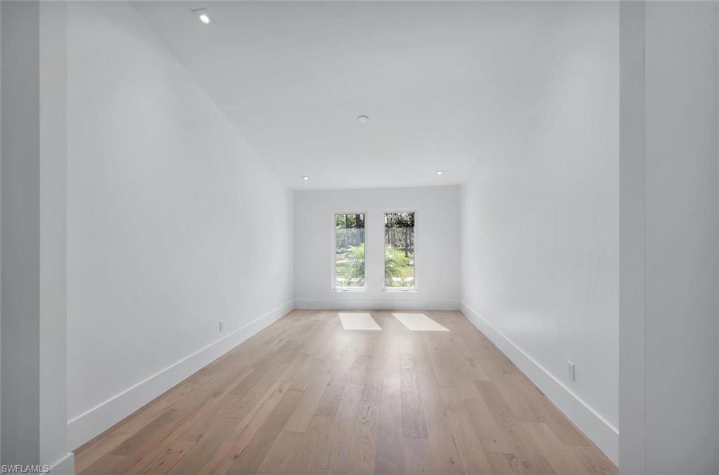 5253 Sycamore Drive Naples, FL 34119 - Photo 11 of 49 an empty room with windows