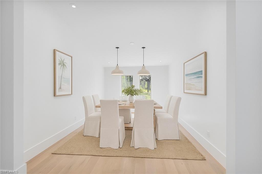 5253 Sycamore Drive Naples, FL 34119 - Photo 12 of 49 a dining room with furniture and window