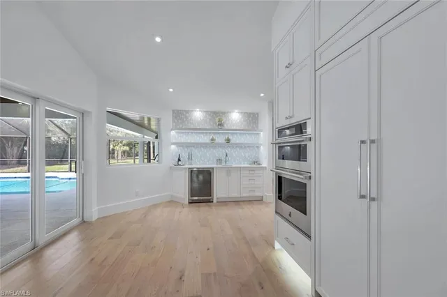 a view of kitchen with wooden floor