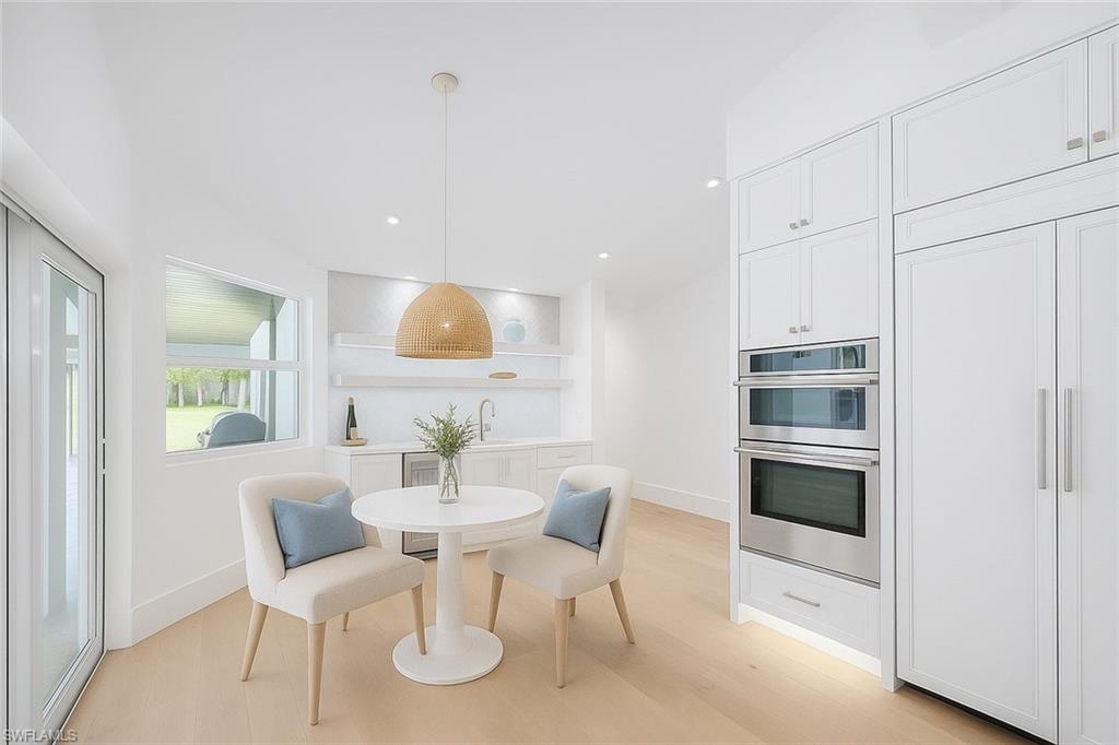5253 Sycamore Drive Naples, FL 34119 - Photo 14 of 49 a view of a dining room with furniture