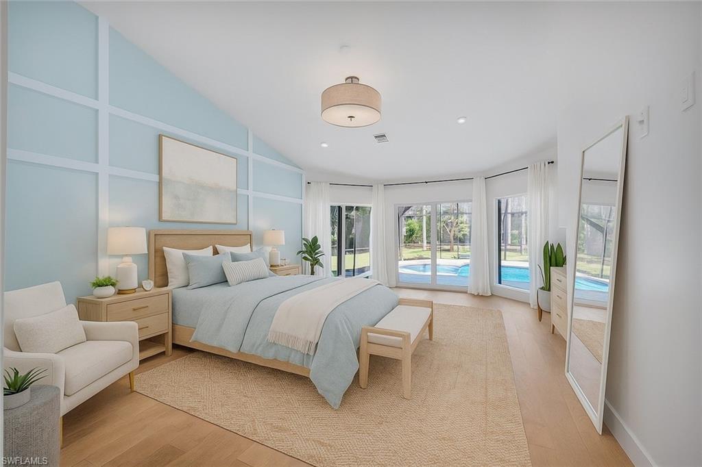 5253 Sycamore Drive Naples, FL 34119 - Photo 20 of 49 a spacious bedroom with a bed and a large window
