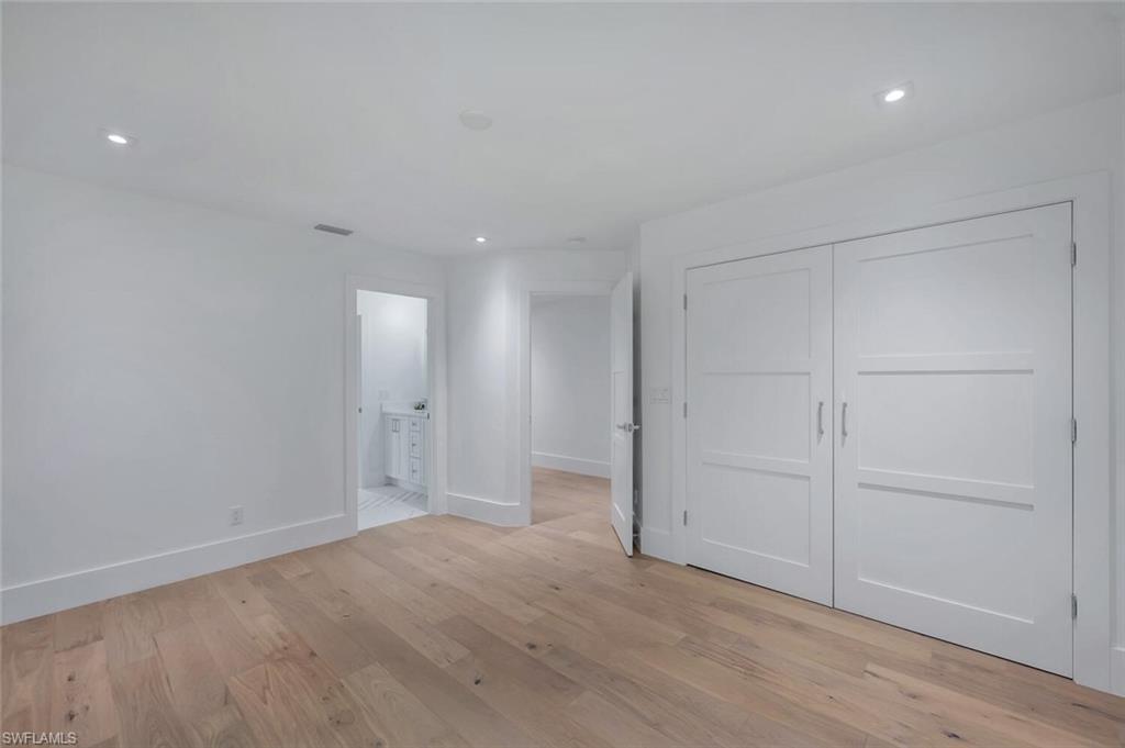 5253 Sycamore Drive Naples, FL 34119 - Photo 30 of 49 wooden floor in an empty room