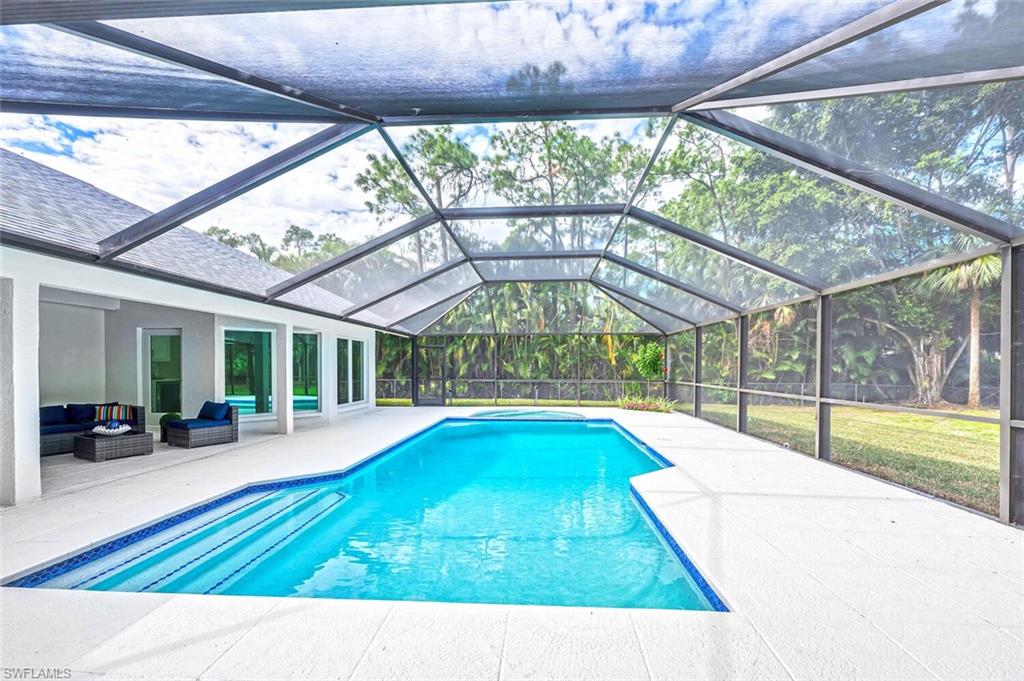 5253 Sycamore Drive Naples, FL 34119 - Photo 3 of 49 a view of swimming pool with seating area