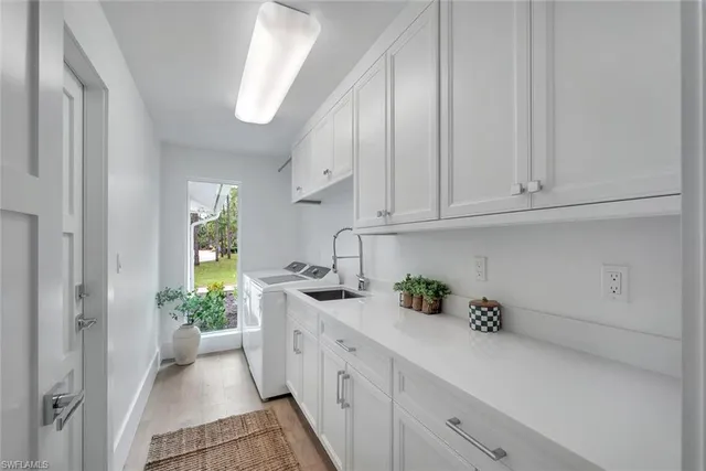 a living room with furniture and large windows