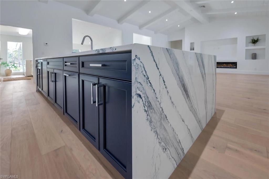 5253 Sycamore Drive Naples, FL 34119 - Photo 7 of 49 a view of a hallway with stairs