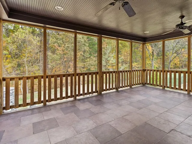 a bathroom with a toilet a sink a mirror and shower
