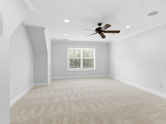 a view of a patio with a table and chairs under an umbrella