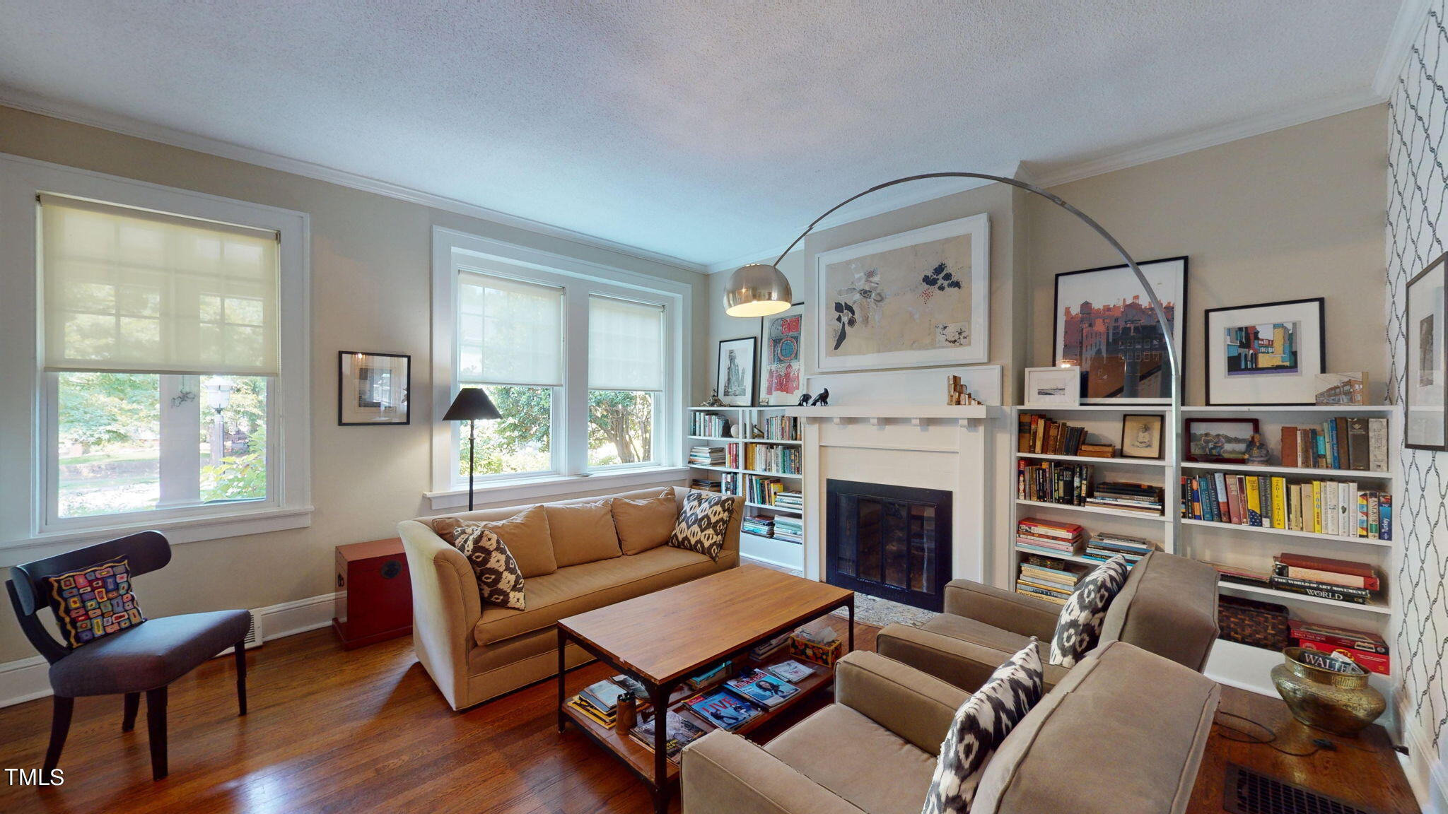 132 Woodburn Road Raleigh, NC 27605 - Photo 12 of 53 a living room with furniture a fireplace and a window