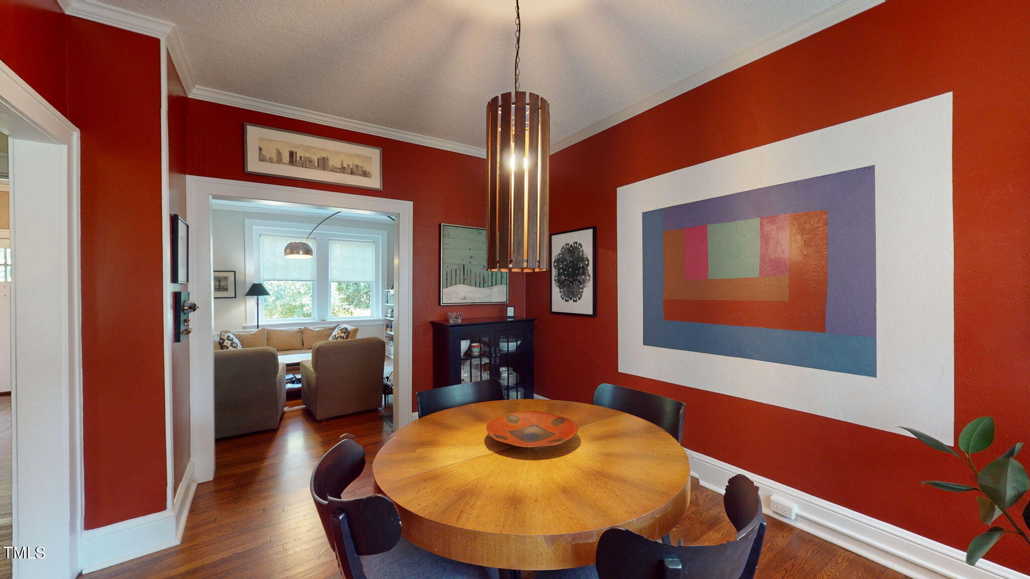 132 Woodburn Road Raleigh, NC 27605 - Photo 14 of 53 a view of a dining room with furniture and wooden floor