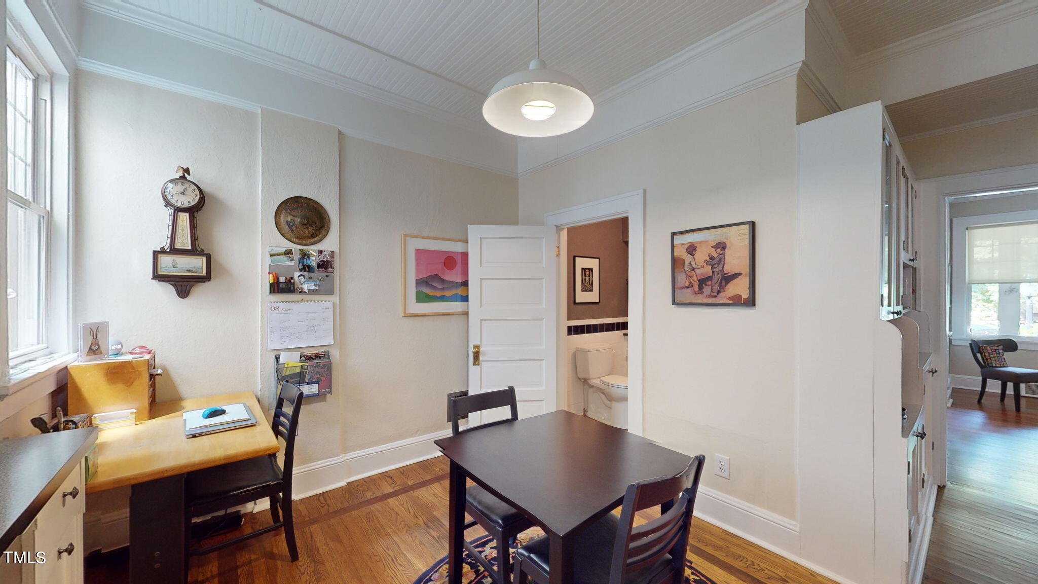132 Woodburn Road Raleigh, NC 27605 - Photo 17 of 53 a view of a workspace with furniture and wooden floor