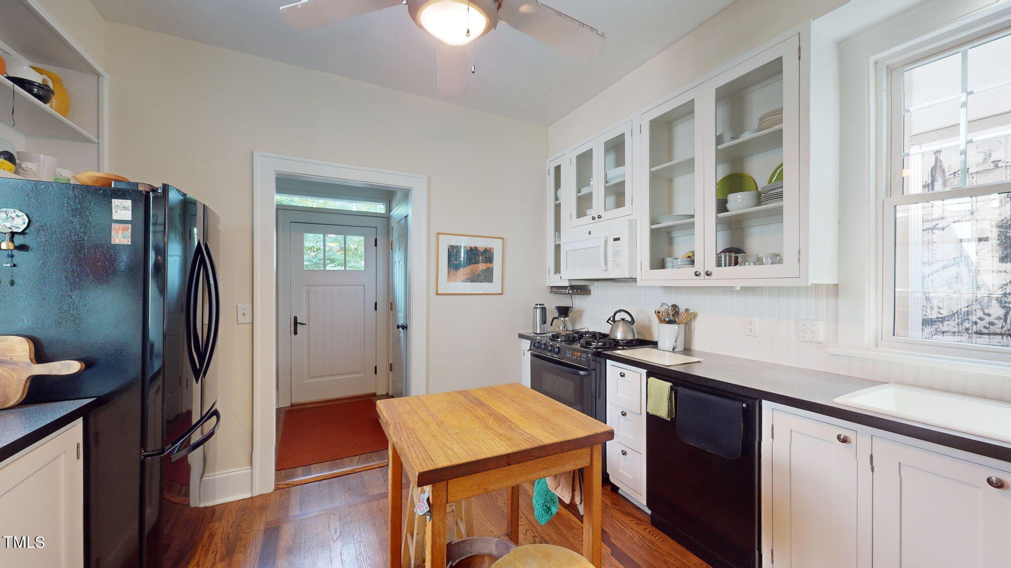 132 Woodburn Road Raleigh, NC 27605 - Photo 19 of 53 a kitchen with stainless steel appliances granite countertop a refrigerator and a sink