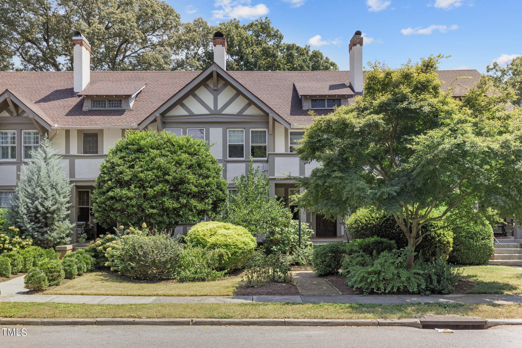 132 Woodburn Road Raleigh, NC 27605 - Photo 2 of 53 a view of a house with a yard and plants