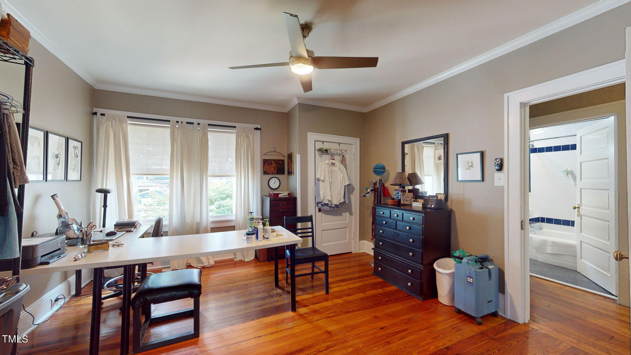 132 Woodburn Road Raleigh, NC 27605 - Photo 27 of 53 a living room with furniture and a wooden floor