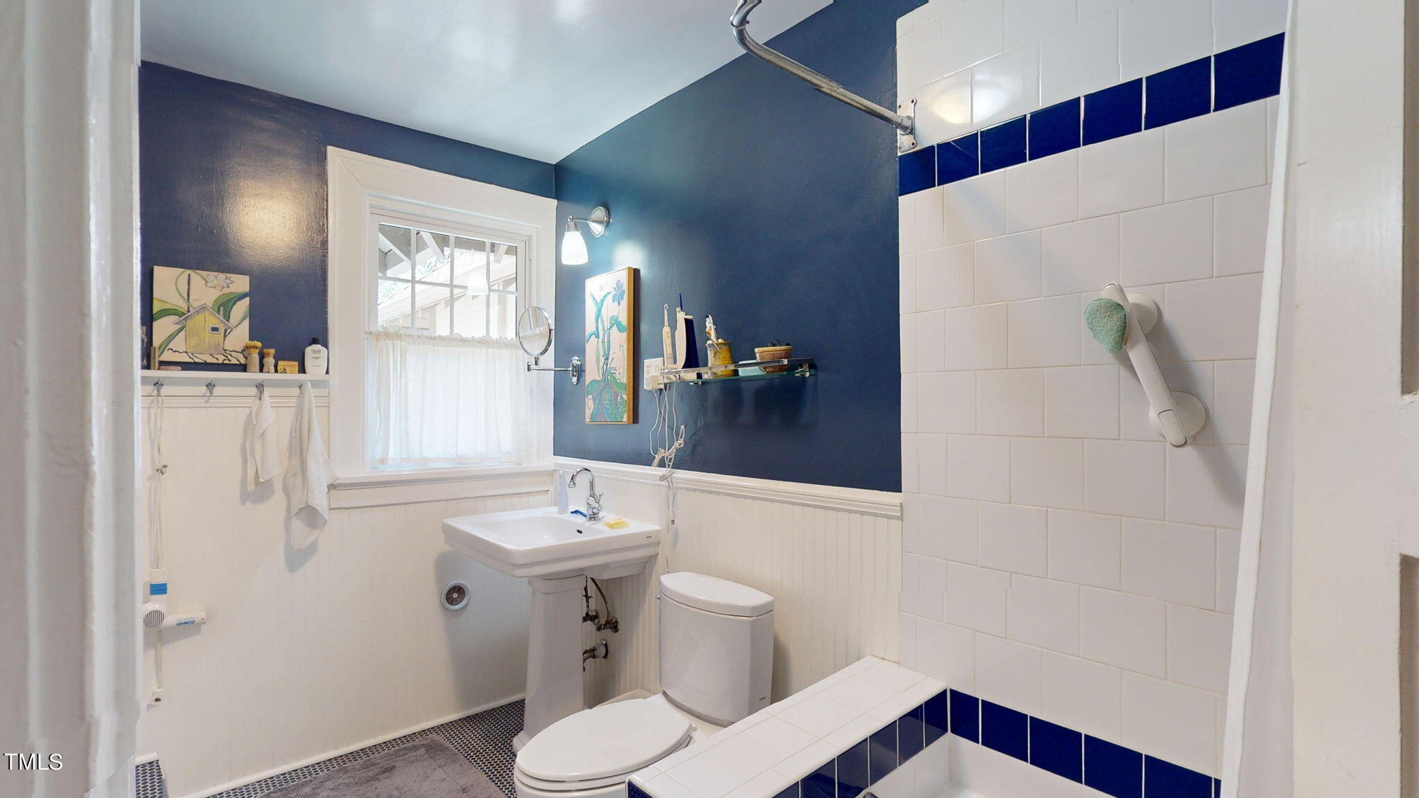 132 Woodburn Road Raleigh, NC 27605 - Photo 28 of 53 a bathroom with a sink toilet and shower