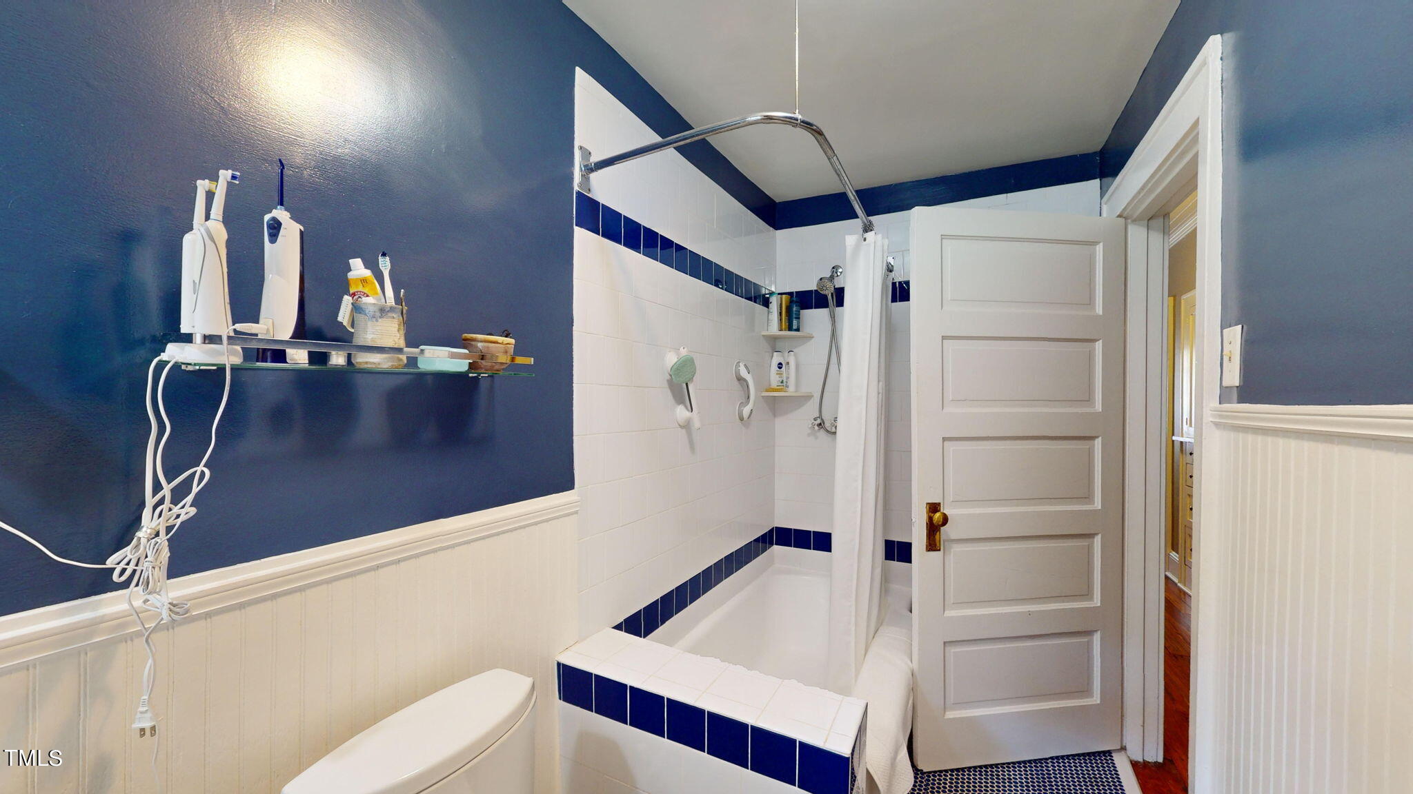 132 Woodburn Road Raleigh, NC 27605 - Photo 29 of 53 a bathroom with a bathtub and a shower
