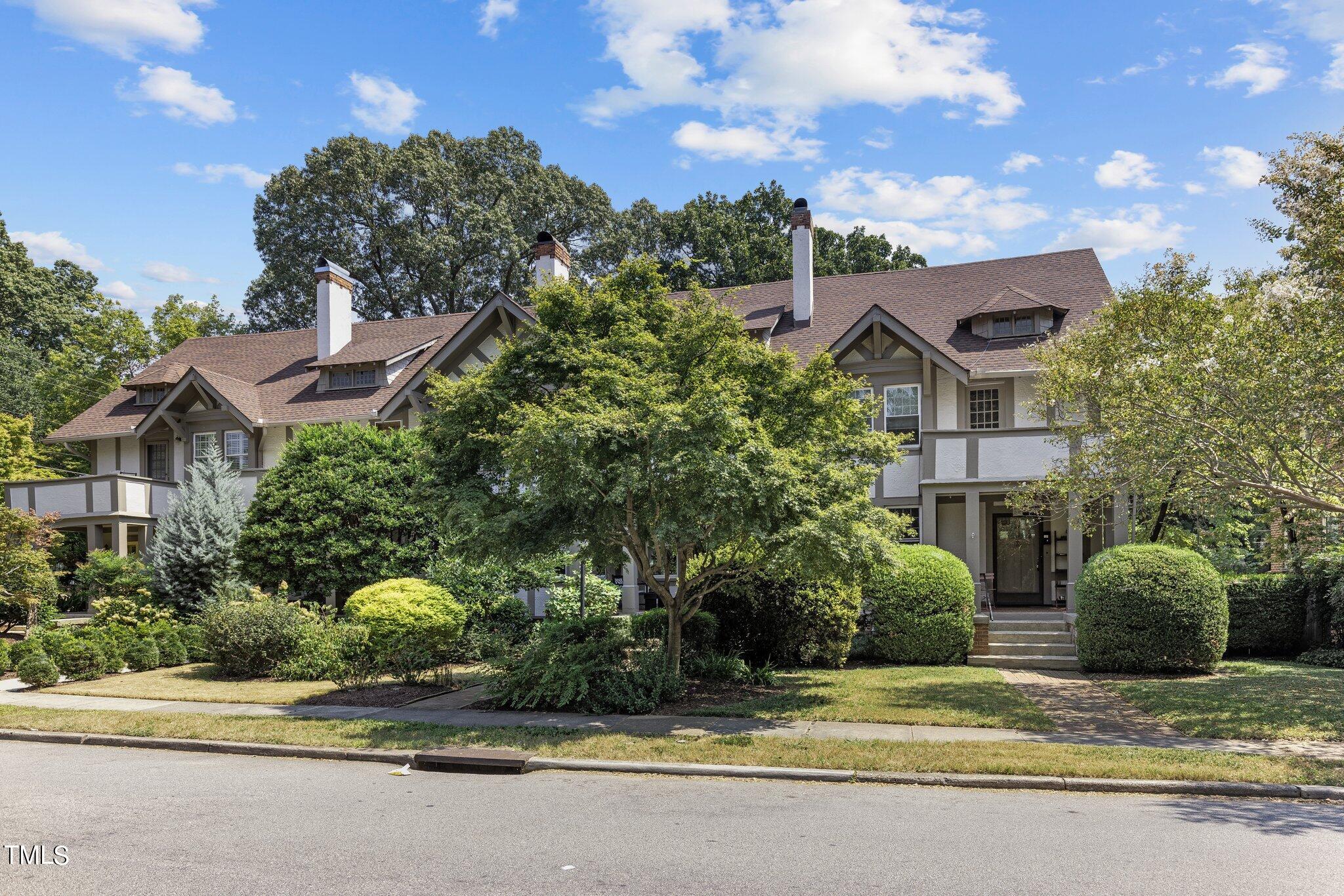 132 Woodburn Road Raleigh, NC 27605 - Photo 3 of 53 a view of a house with a garden and pathway