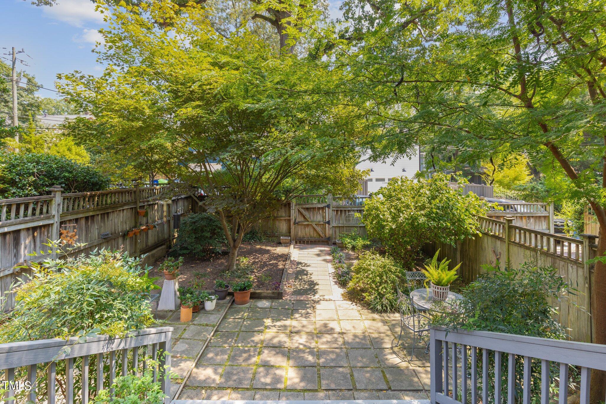 132 Woodburn Road Raleigh, NC 27605 - Photo 40 of 53 a backyard of a house with lots of green space