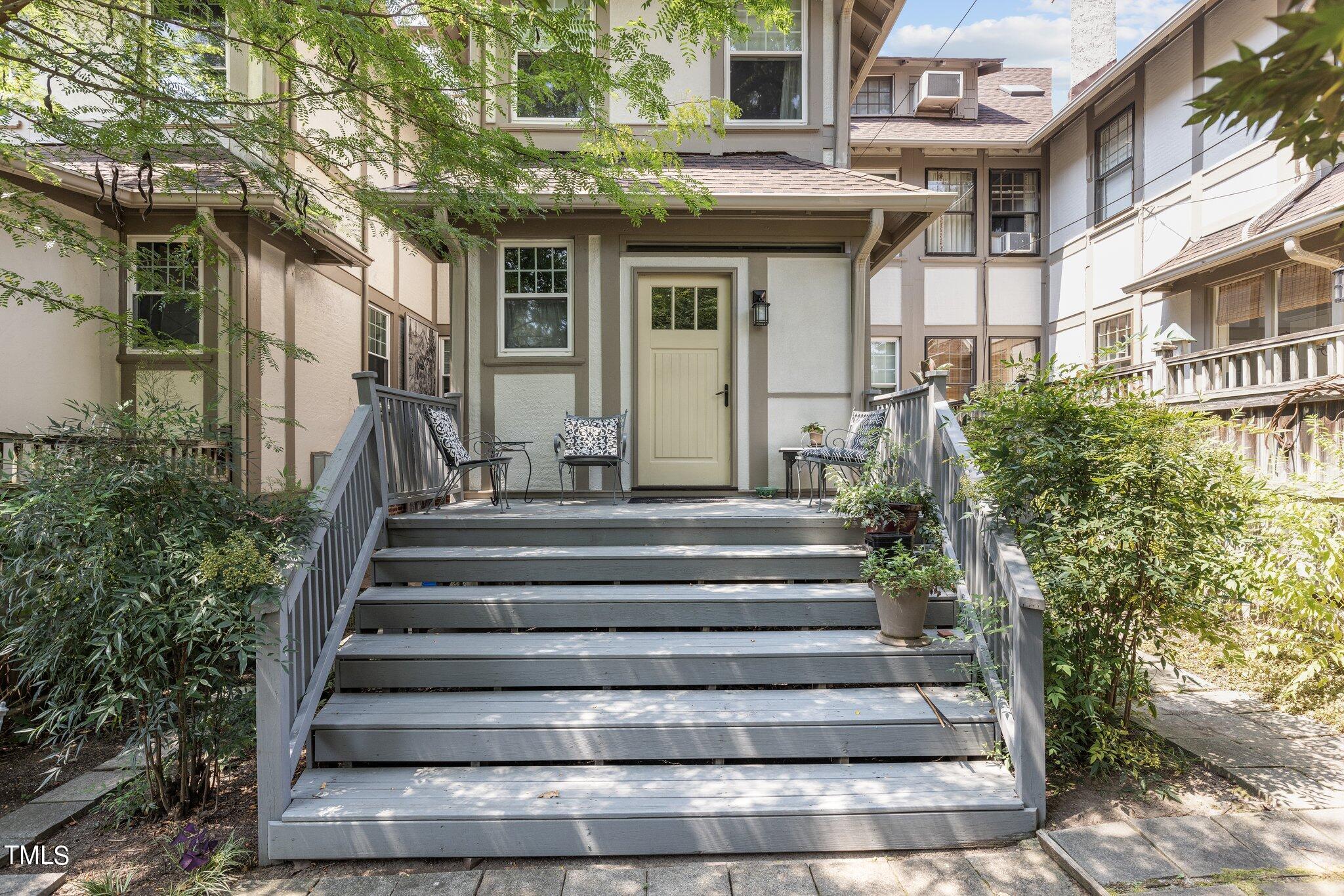 132 Woodburn Road Raleigh, NC 27605 - Photo 42 of 53 a view of a house with more windows and brick walls
