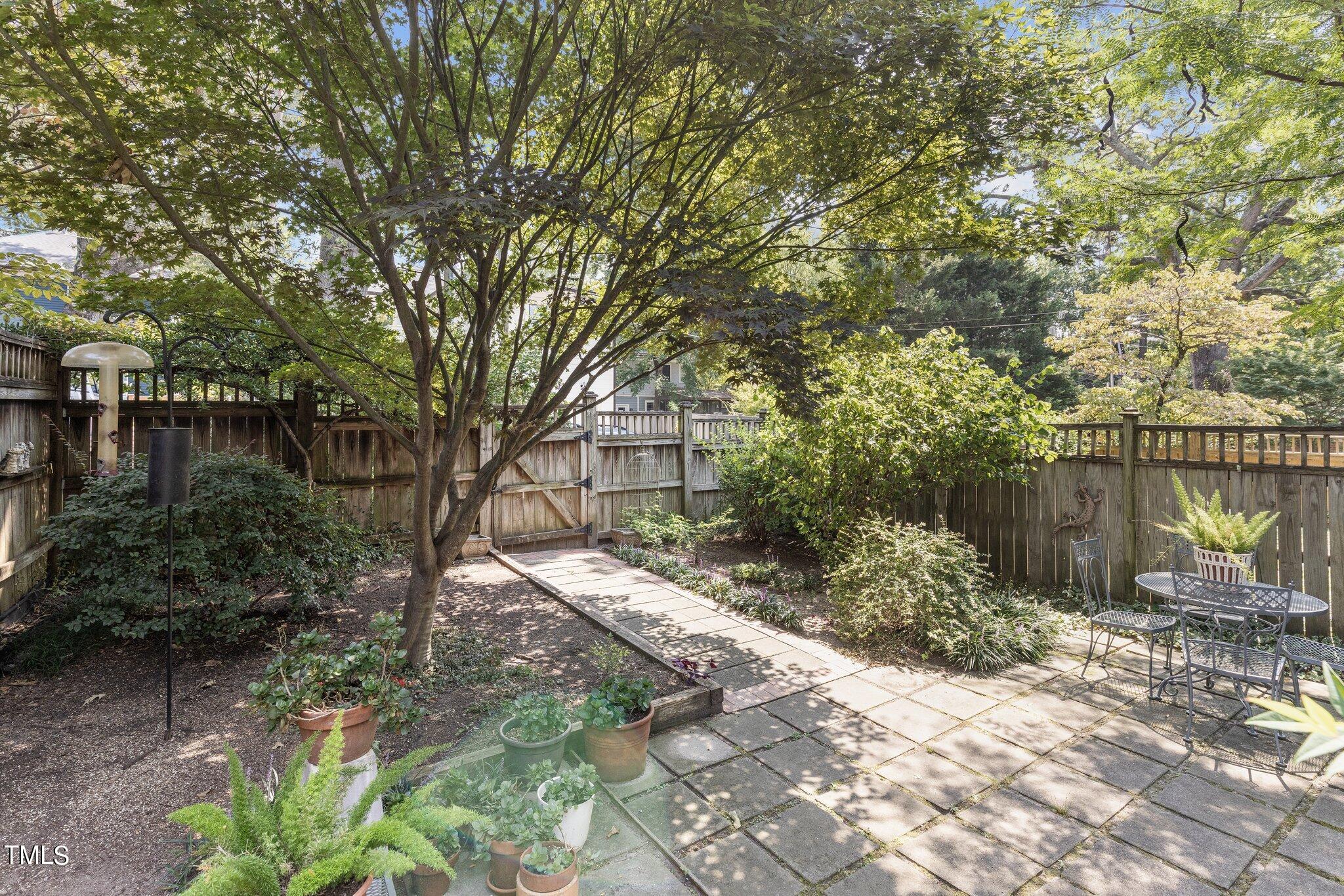 132 Woodburn Road Raleigh, NC 27605 - Photo 44 of 53 a backyard of a house with lots of green space