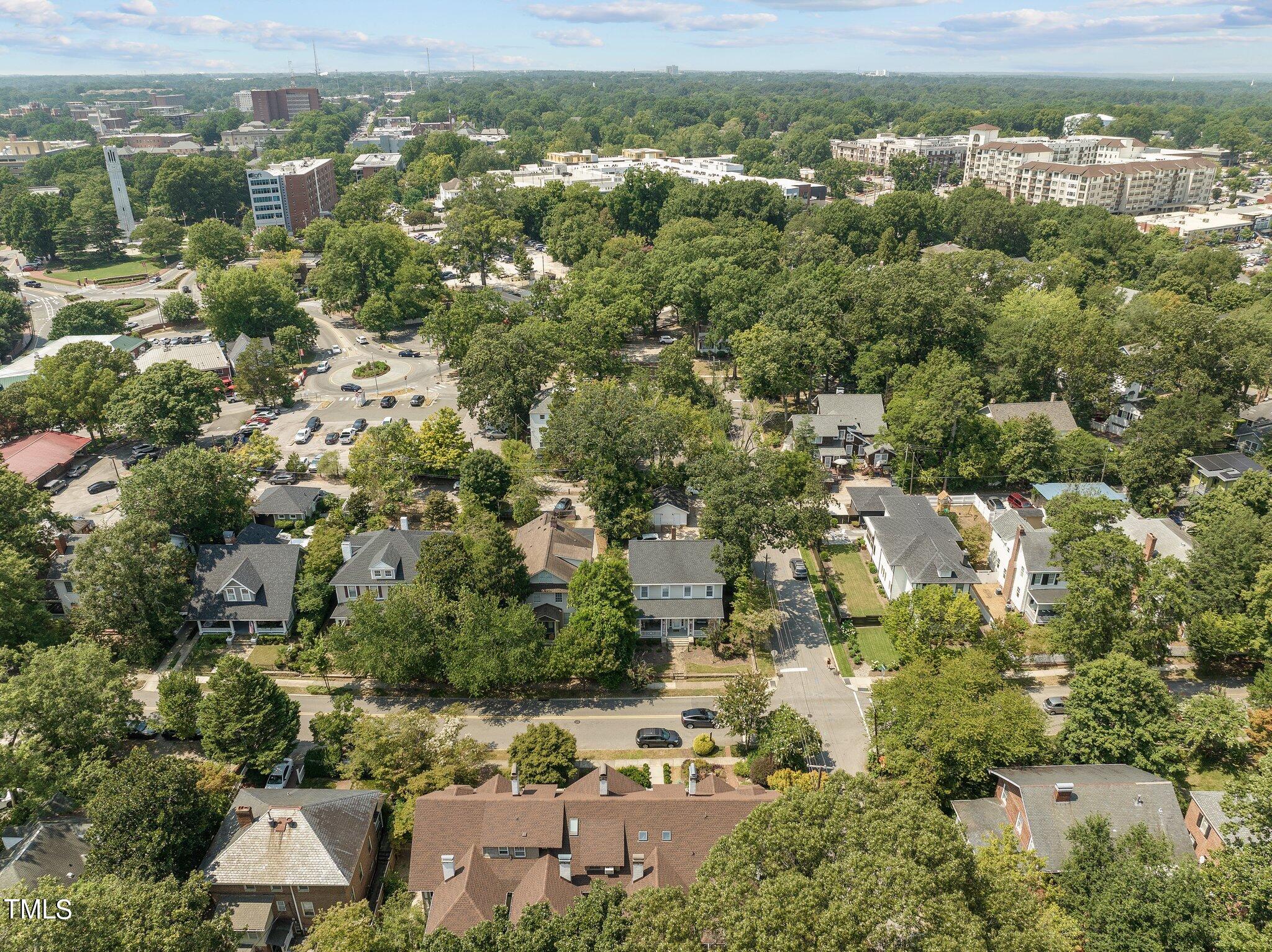 132 Woodburn Road Raleigh, NC 27605 - Photo 52 of 53 an aerial view of residential houses with outdoor space and trees