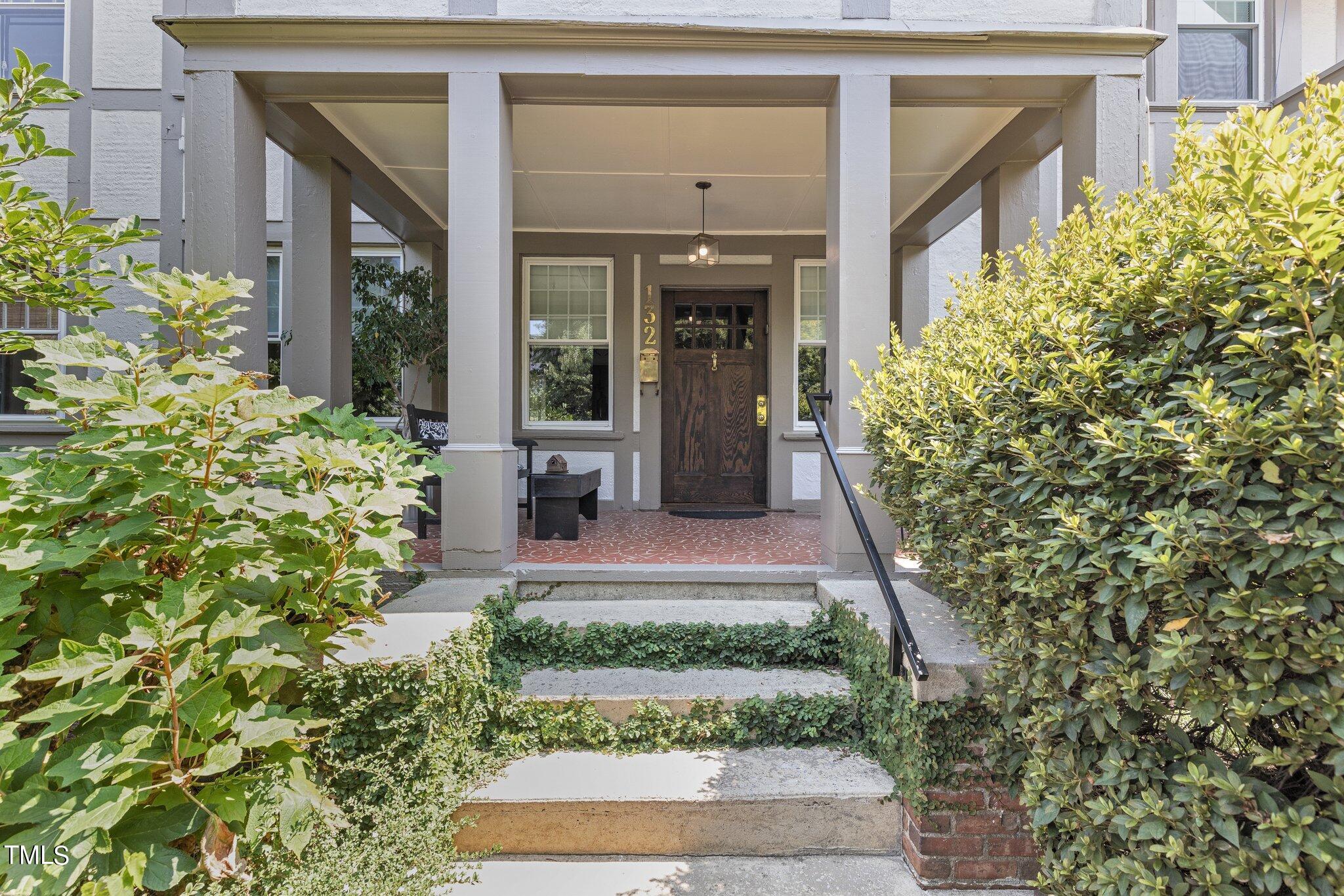 132 Woodburn Road Raleigh, NC 27605 - Photo 7 of 53 a front view of a house with a yard