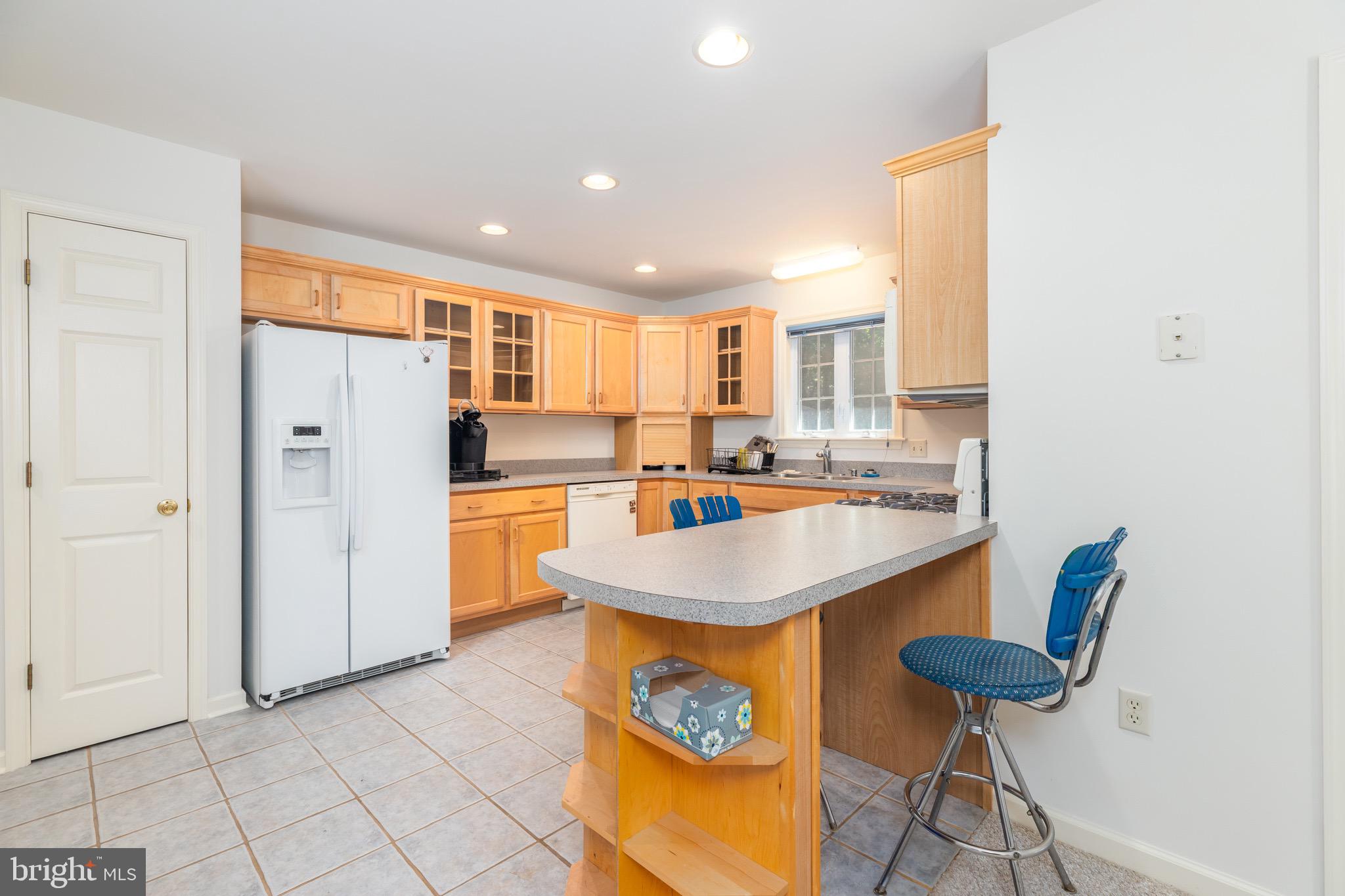 140 Pinehurst Road Ocean Pines, MD 21811 - Photo 11 of 32 a kitchen with stainless steel appliances granite countertop a sink and a refrigerator