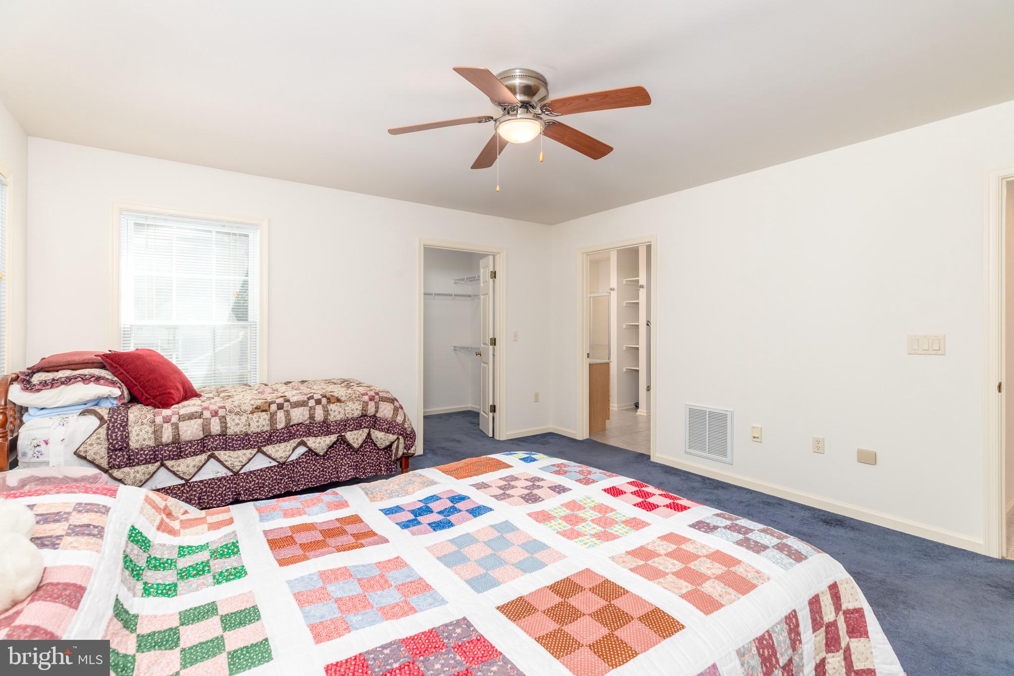 140 Pinehurst Road Ocean Pines, MD 21811 - Photo 14 of 32 a bedroom with a bed and a window