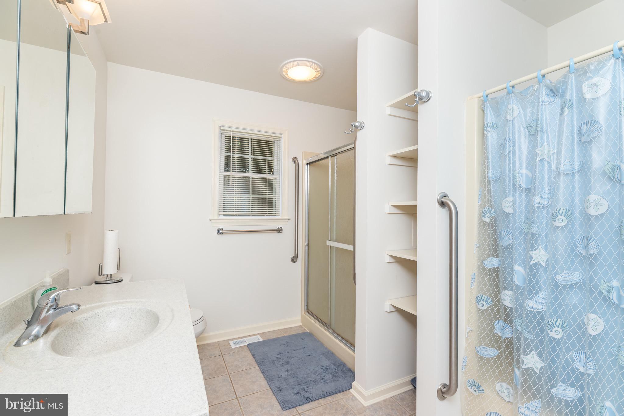 140 Pinehurst Road Ocean Pines, MD 21811 - Photo 15 of 32 a bathroom with a sink a toilet and shower