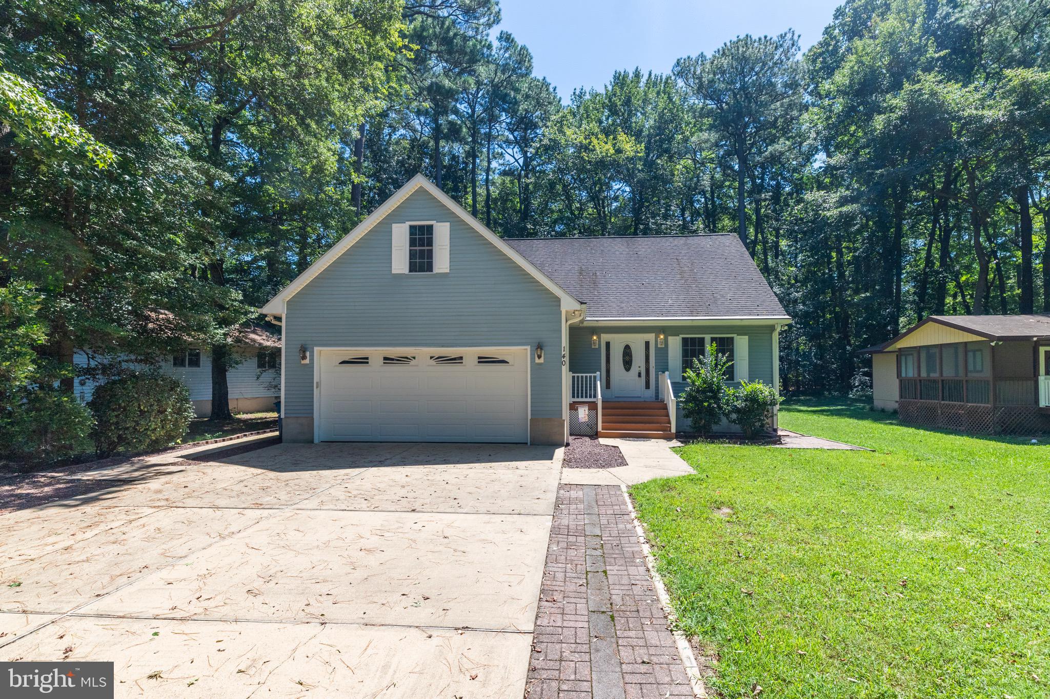 140 Pinehurst Road Ocean Pines, MD 21811 - Photo 2 of 32 a front view of house with yard and green space