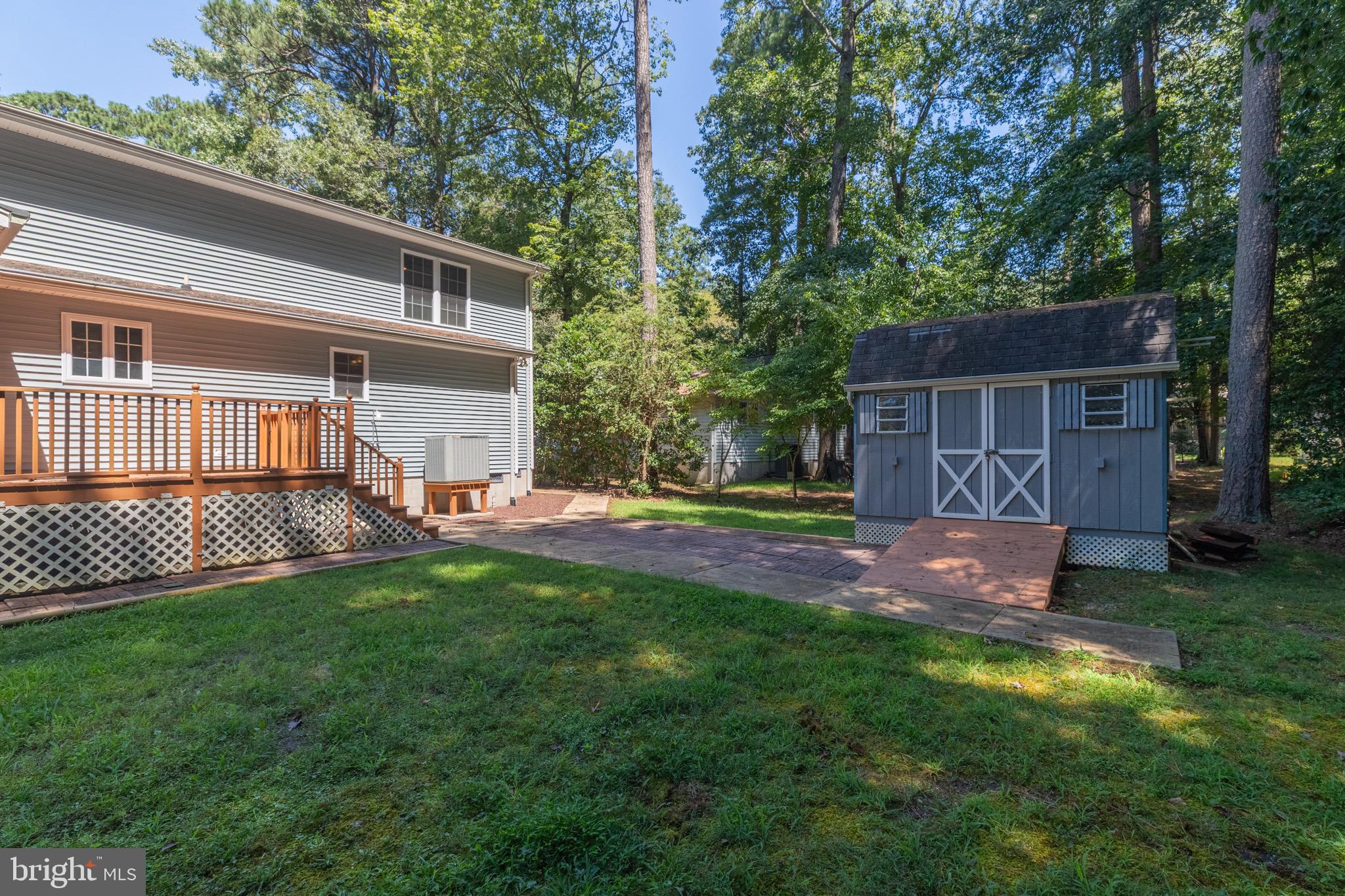 140 Pinehurst Road Ocean Pines, MD 21811 - Photo 23 of 32 a view of a house with a yard and a patio