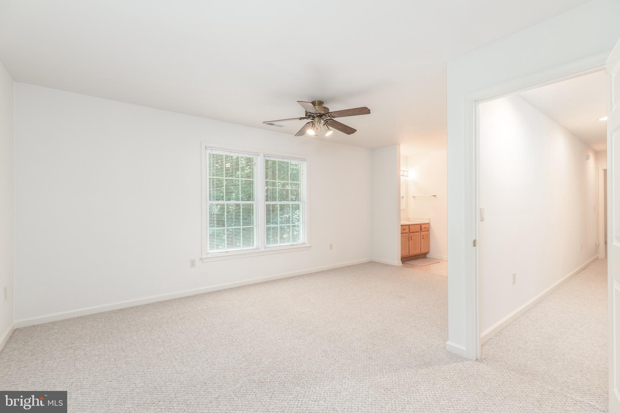 140 Pinehurst Road Ocean Pines, MD 21811 - Photo 24 of 32 an empty room with a ceiling fan and a window
