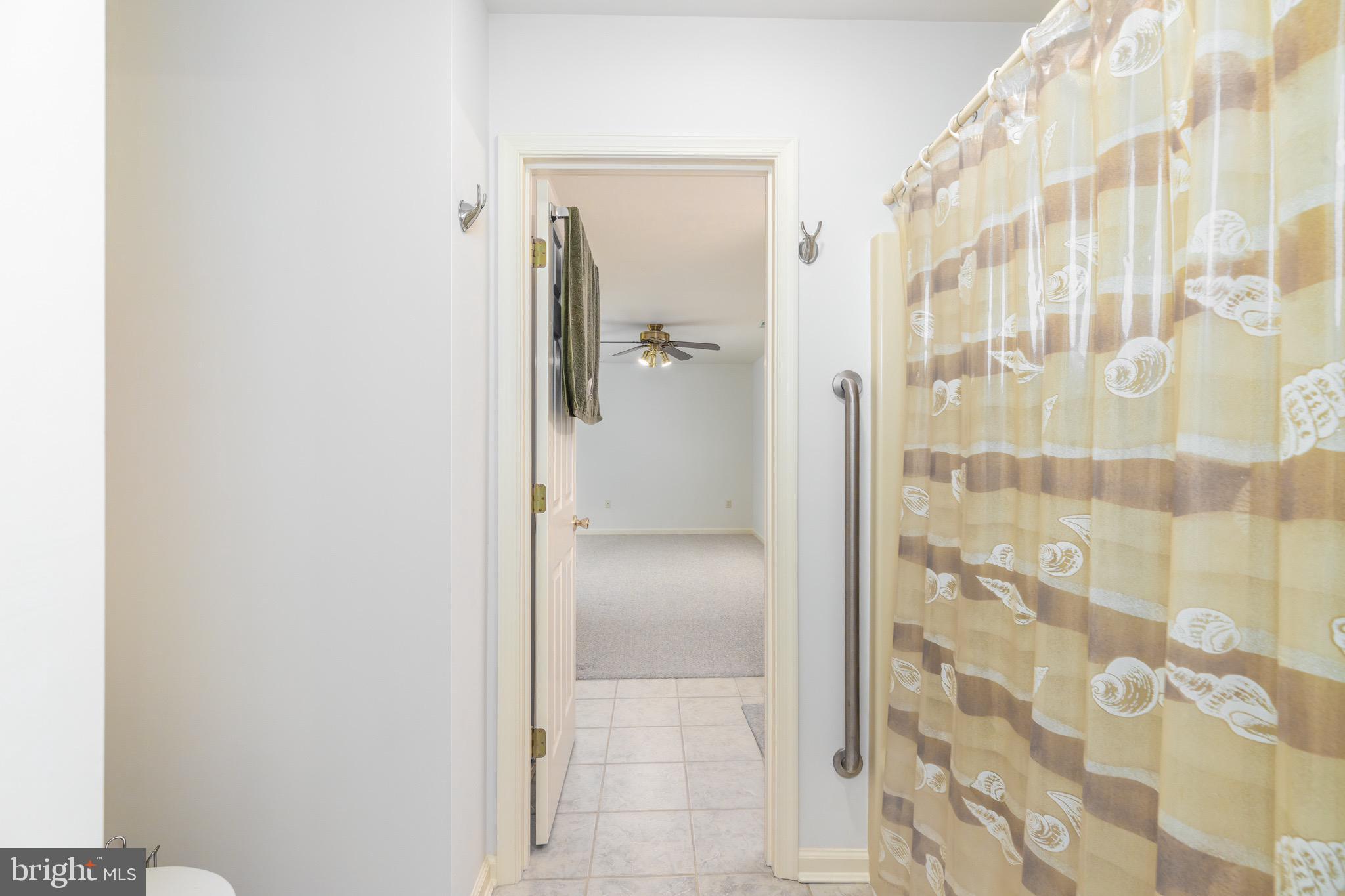 140 Pinehurst Road Ocean Pines, MD 21811 - Photo 29 of 32 a bathroom with a glass shower door