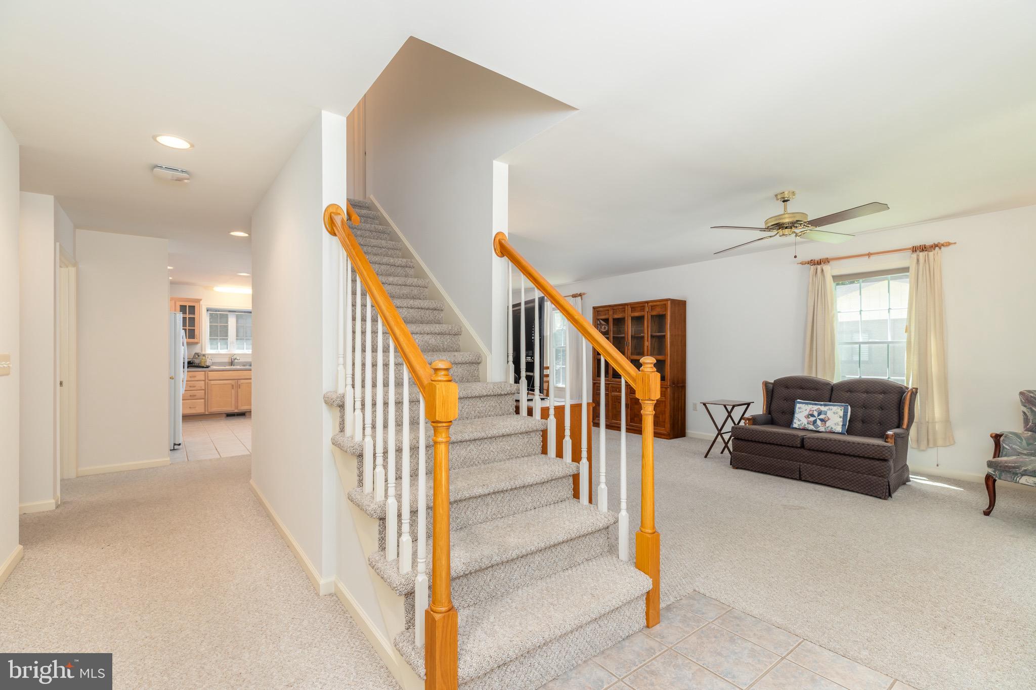 140 Pinehurst Road Ocean Pines, MD 21811 - Photo 4 of 32 a view of a livingroom with wooden floor and stairs