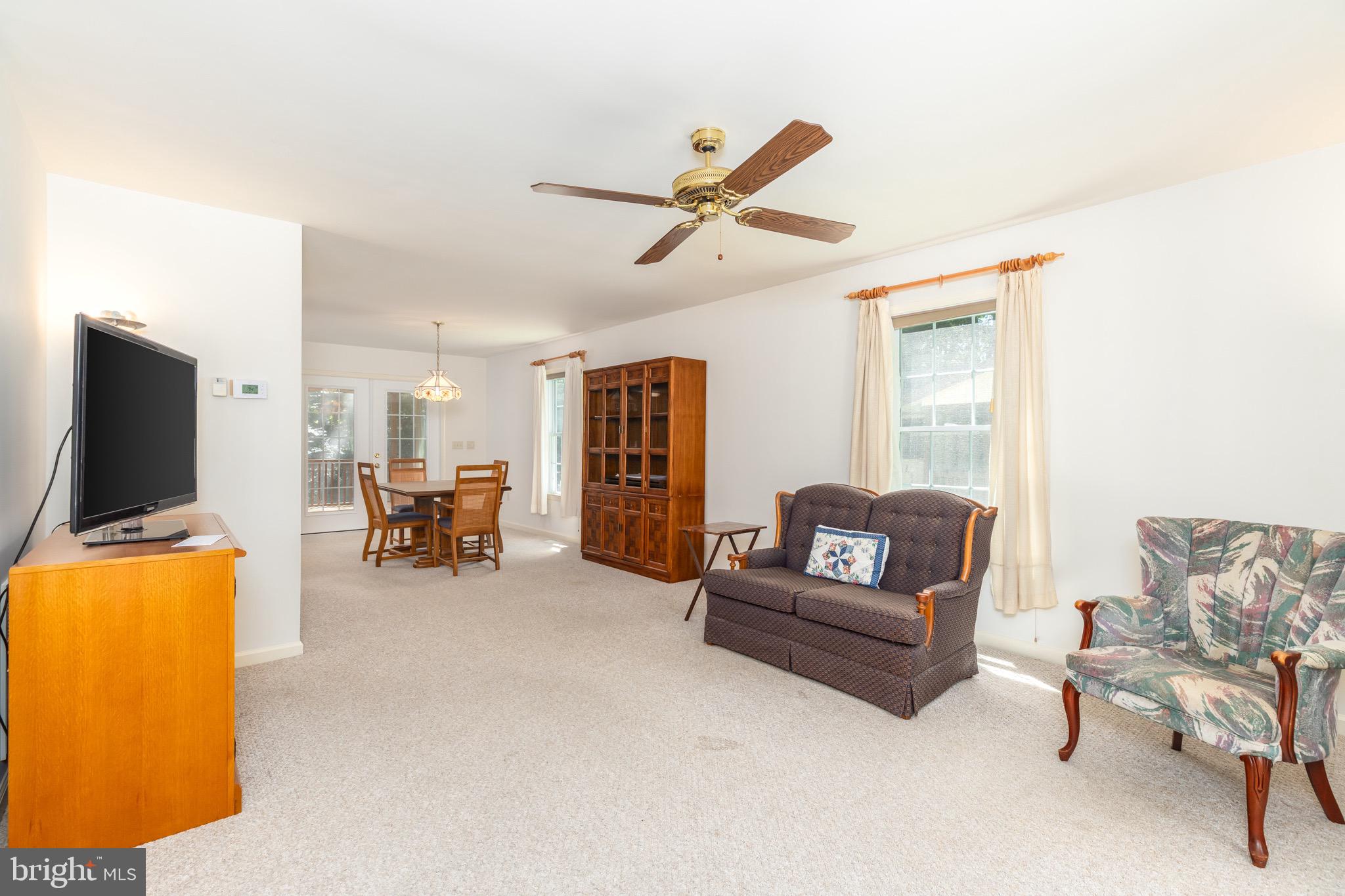 140 Pinehurst Road Ocean Pines, MD 21811 - Photo 6 of 32 a living room with furniture and a flat screen tv