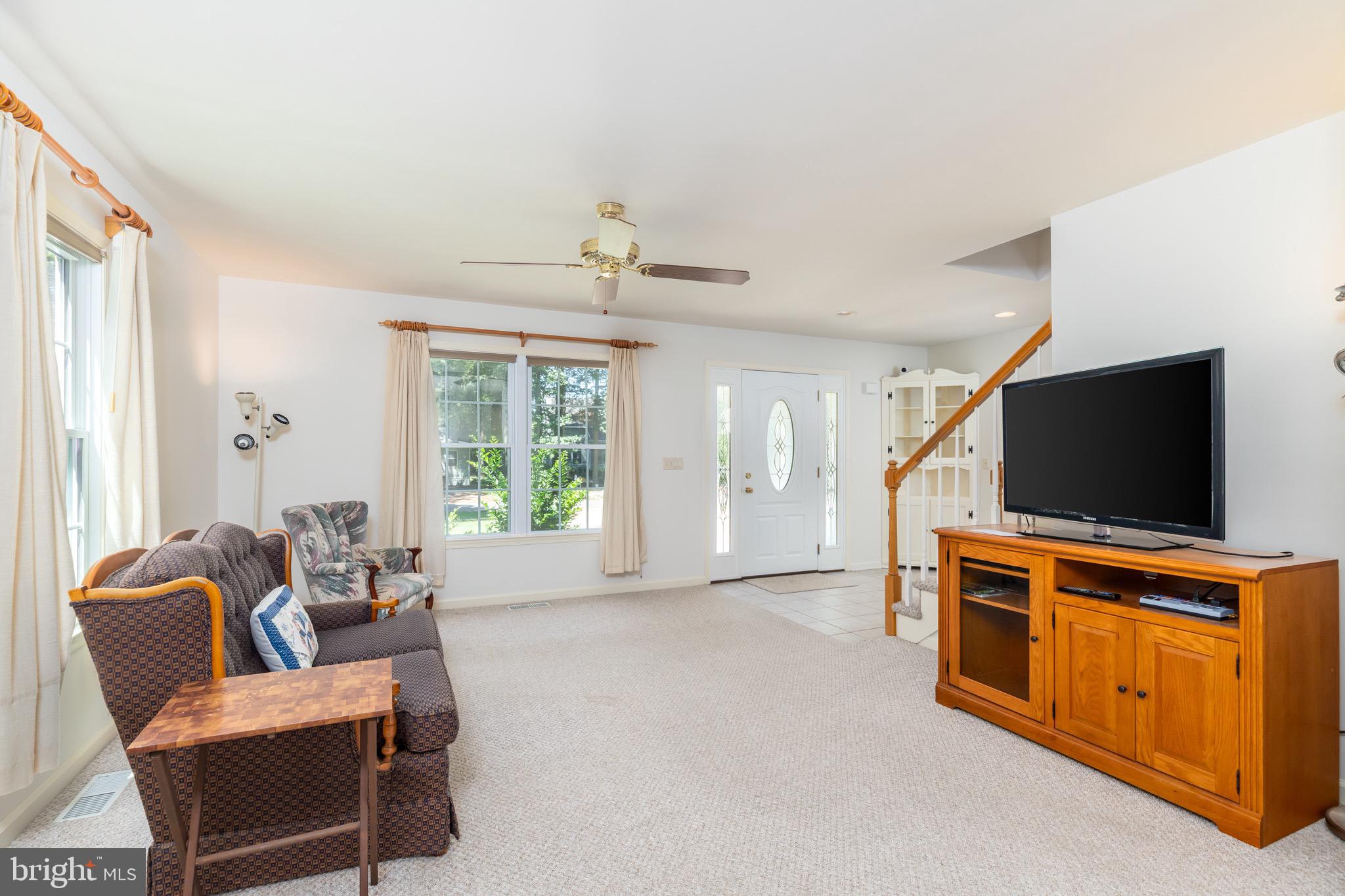 140 Pinehurst Road Ocean Pines, MD 21811 - Photo 7 of 32 a living room with furniture and a flat screen tv