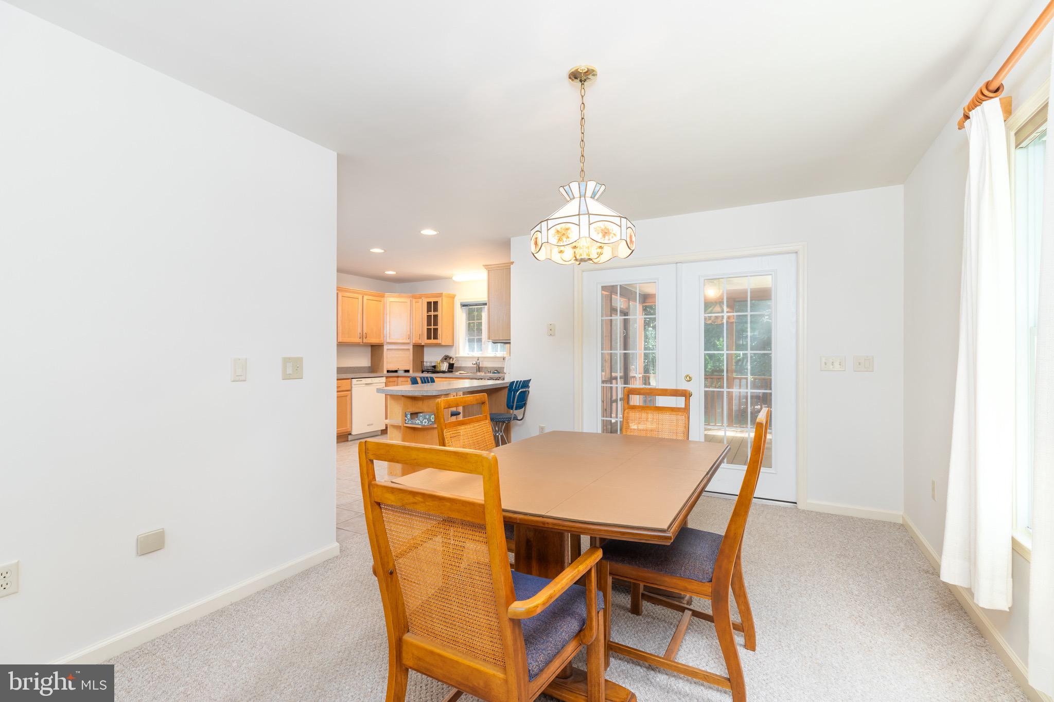 140 Pinehurst Road Ocean Pines, MD 21811 - Photo 8 of 32 a view of a dining room with furniture window and wooden floor