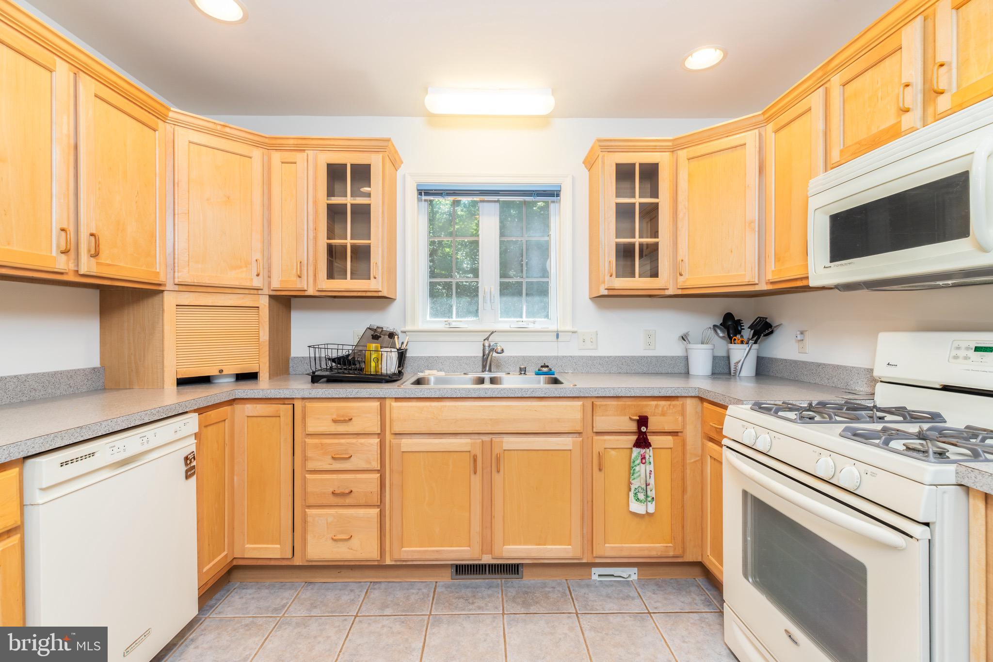 140 Pinehurst Road Ocean Pines, MD 21811 - Photo 9 of 32 a kitchen with cabinets appliances and a sink