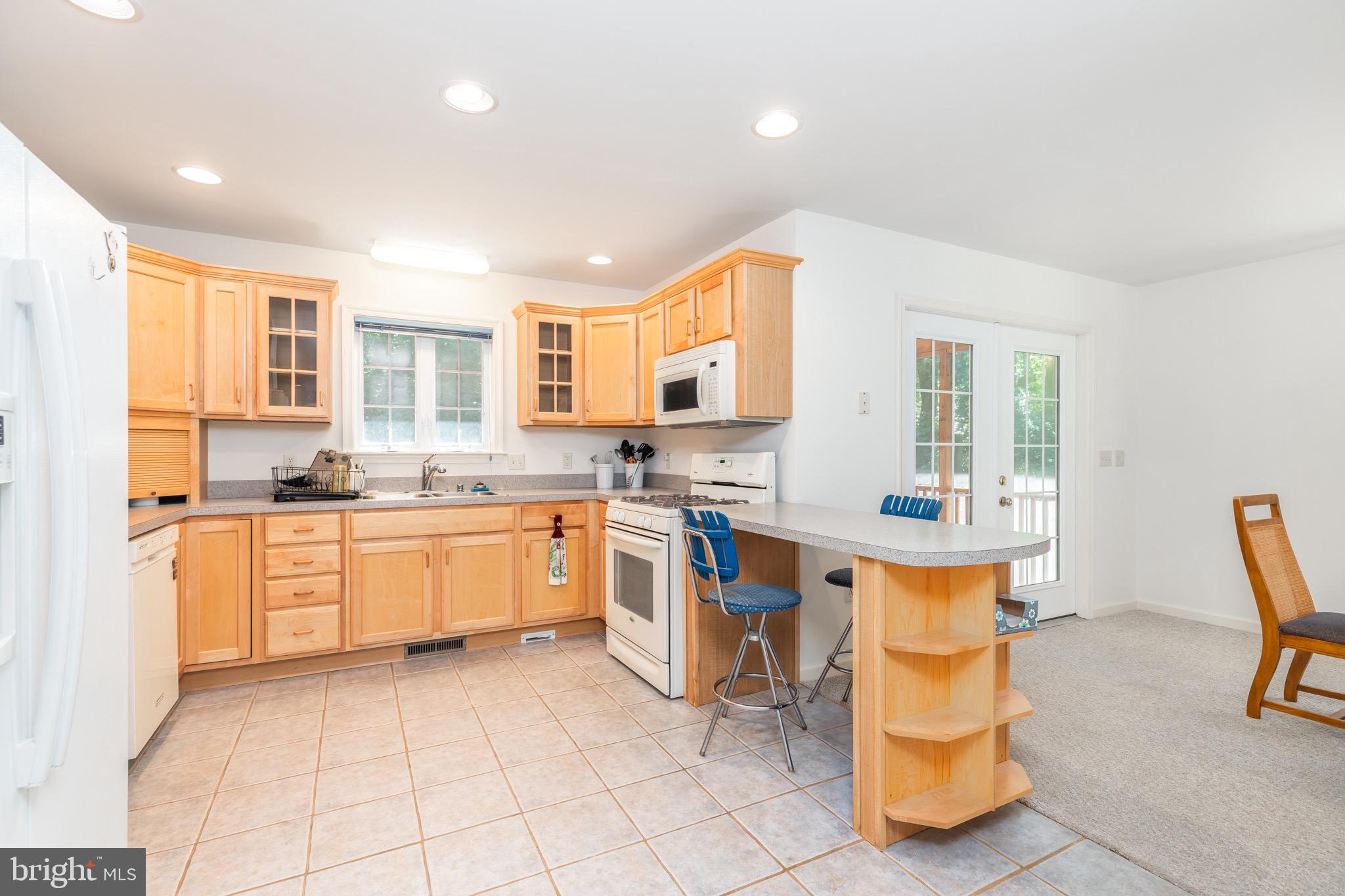140 Pinehurst Road Ocean Pines, MD 21811 - Photo 10 of 32 a kitchen with a sink cabinets and window